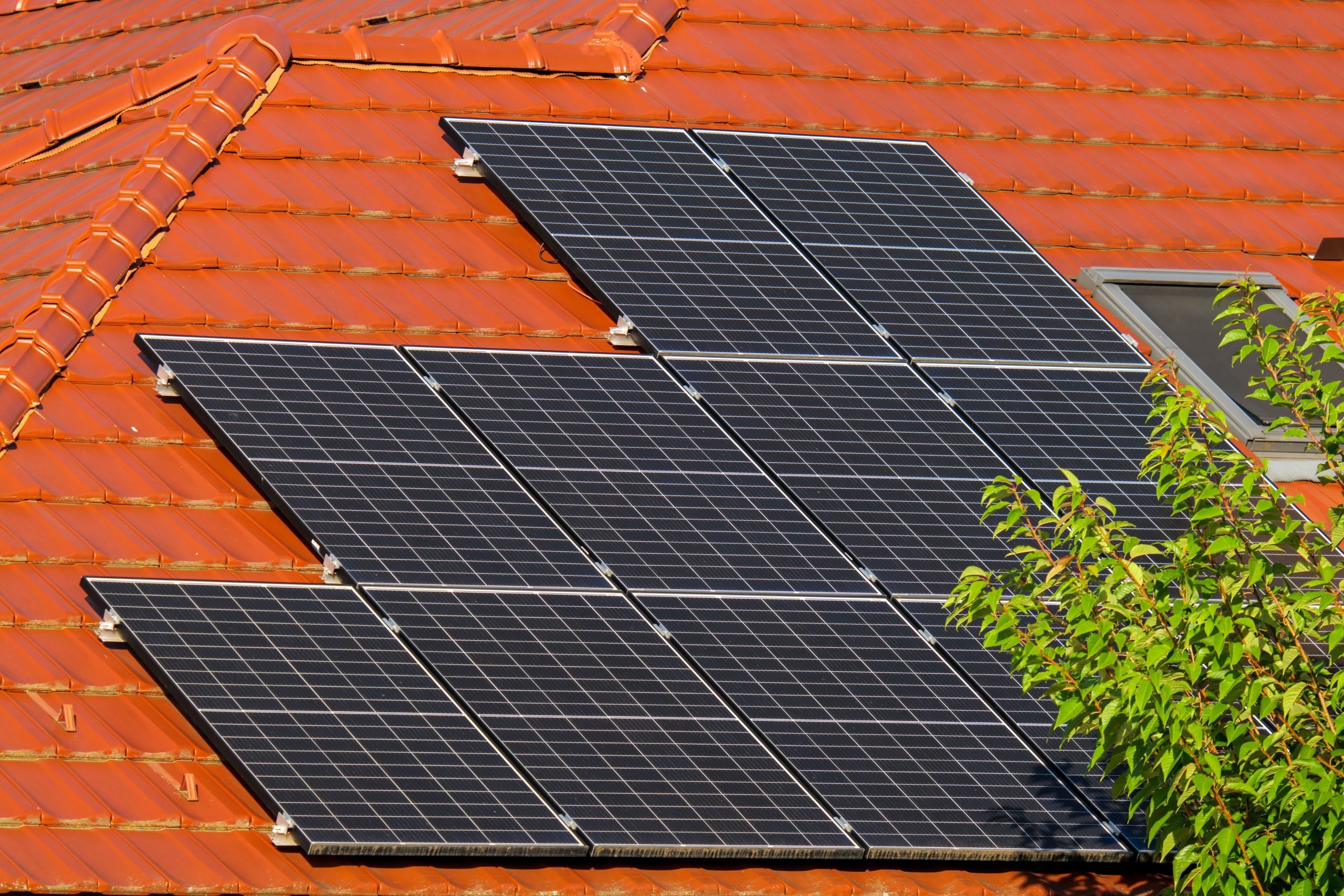 Best EV Chargers for Solar Panel Owners 1 Solar panels on a house roof