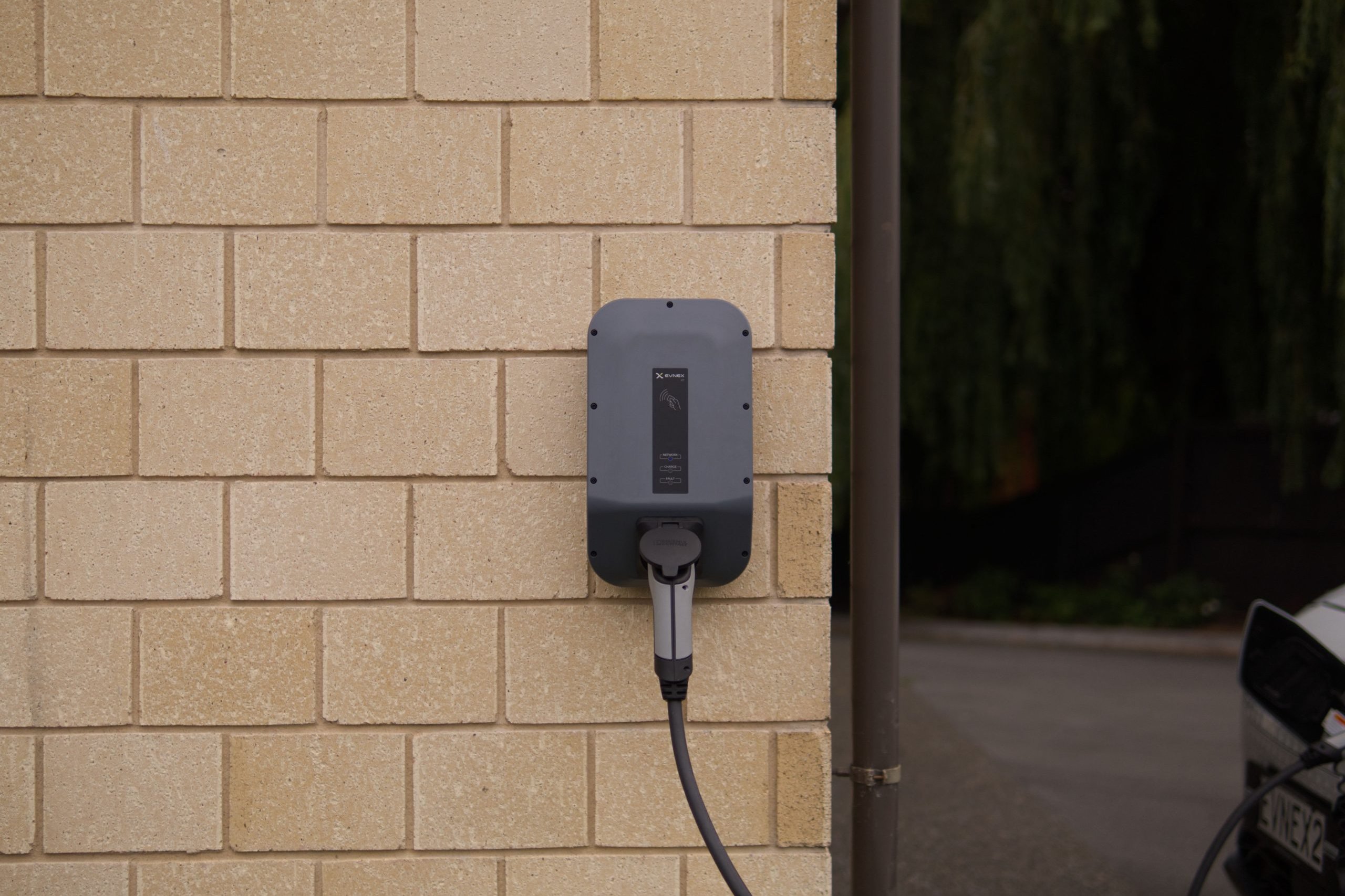 Home EV charger mounted on a wall